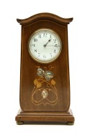 Lot 353 - An Edwardian Art Nouveau mahogany and inlaid mantel clock