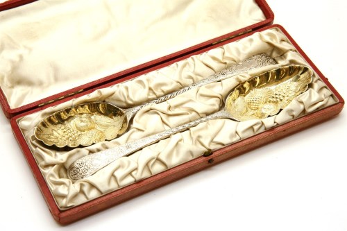 Lot 188 - A cased pair of Victorian silver berry spoons