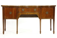 Lot 538 - A mahogany and serpentine front sideboard