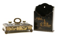 Lot 289 - A late 19th century lacquer desk stand with gilt decoration and applied brass handle between two glass inkwells