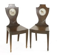 Lot 903 - A pair of George III mahogany hall chairs