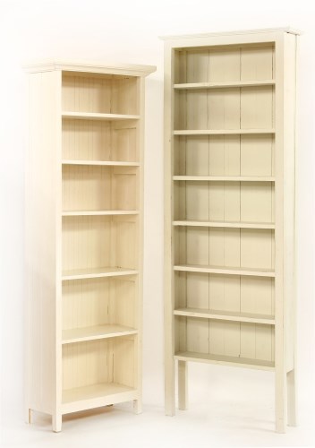 Lot 567 - Two white painted narrow bookshelves