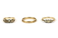 Lot 34 - A 9ct gold three stone illusion set diamond ring