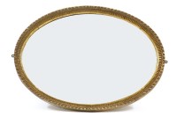 Lot 631 - An early 20th century oval gilt framed wall mirror