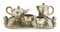 Lot 247 - A Tudric pewter four-piece tea set