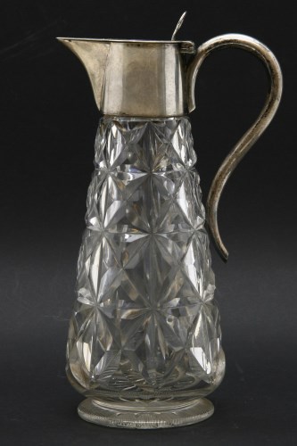 Lot 141 - A silver mounted claret jug