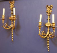 Lot 350 - A pair of twin light gilt brass and gesso wall lights