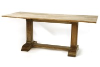 Lot 573 - An oak plank top refectory table