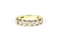 Lot 8 - A 9ct gold five stone diamond half eternity ring