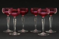 Lot 239 - A set of six cranberry glass hock glasses