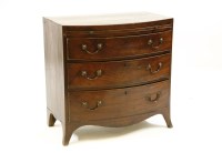 Lot 563 - A George lll mahogany bow front bachelors chest