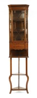 Lot 753 - An Edwardian mahogany standing corner cabinet