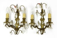 Lot 798 - A pair of brass and cut glass two-branch wall lights