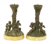 Lot 751 - A pair of bronze candlesticks