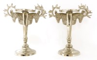 Lot 720 - A pair of silvered candle stands