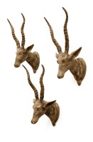 Lot 721 - A set of three carved wooden and painted Indian-style antelope trophy heads