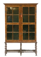 Lot 519 - An early 20th Century Queen Anne style walnut cabinet on stand