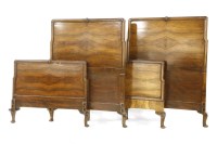 Lot 599 - A pair of Queen Anne style Heal & Son walnut single beds