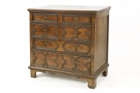 Lot 475 - An oak geometric panelled chest