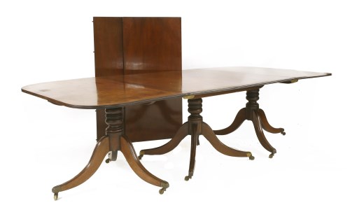 Lot 523 - A George III mahogany three-pillar dining table