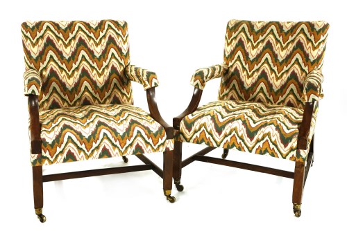 Lot 514 - Two similar George III mahogany Gainsborough chairs