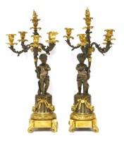 Lot 749 - A pair of bronze and ormolu five-light candelabra