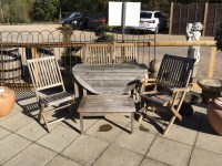 Lot 1168 - A teak slatted garden suite