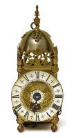 Lot 880 - A small brass lantern clock