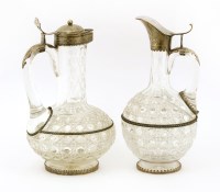 Lot 264 - A near pair of mid-19th century German jug glass and silver-mounted claret jugs
