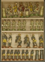 Lot 399 - A painted terracotta chess set