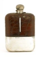 Lot 242 - A large silver and crocodile skin bound flask