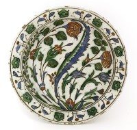 Lot 338 - An Iznik pottery dish