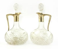 Lot 287 - A pair of Continental cut -glass and silver-mounted claret jugs