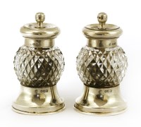 Lot 277 - A pair of silver and cut-glass pepper mills