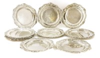 Lot 179 - A set of twelve William IV silver dinner plates