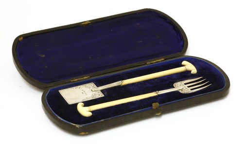 Lot 32 - A late Victorian ivory-handled silver miniature spade and gardening fork