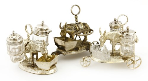 Lot 84 - Two late Victorian silver electroplated donkey and trough cruet sets