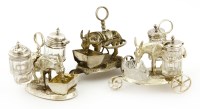 Lot 84 - Two late Victorian silver electroplated donkey and trough cruet sets