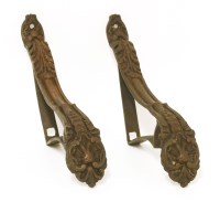 Lot 311 - A pair of rococo-style bronze curtain tiebacks