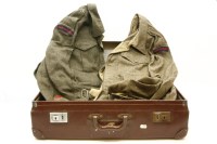 Lot 486 - A vintage case containing a collection of Royal Artillery uniforms