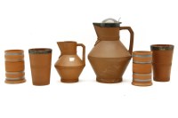 Lot 392 - Watcomb pottery: a jug and a pair of beakers with silver mounts