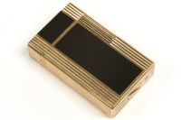 Lot 39 - An S T Dupont gold plated lighter