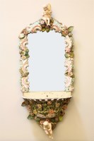 Lot 540 - A porcelain wall mirror