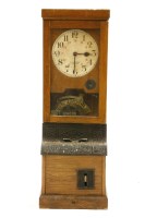 Lot 659 - An oak time record clock
