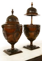 Lot 816 - A pair of mahogany cutlery urns