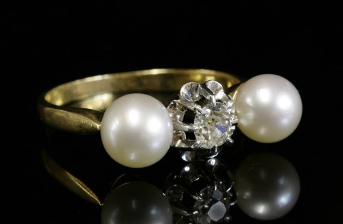 Lot 4 - A three stone diamond and cultured pearl ring
