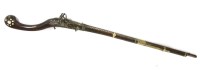 Lot 362 - A 19th century Eastern hardwood steel and brass flintlock rifle