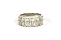 Lot 1 - An 18ct white gold two row diamond band ring