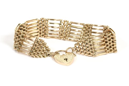 Lot 66 - A gold six row gate link bracelet