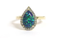 Lot 64 - A gold pear shaped synthetic opal and diamond cluster ring
